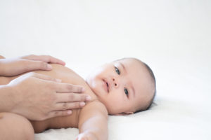 Mother hands touching baby with love and care, Asian baby girl after shower