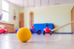 Close up of toy foam ball in a gym hall of a Kindergarten