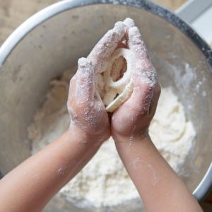 hands in dough
