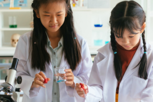 two girls doing science activities
