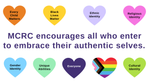 Purple Text reads: MCRC encourages all who enter to embrace their authentic selves. Hearts of various colours read: Every Child Matters, Black Lives Matter, Ethnic Identity, Religious Identity, Gender Identity, Unique Abilities, Everyone, Cultural Identity.