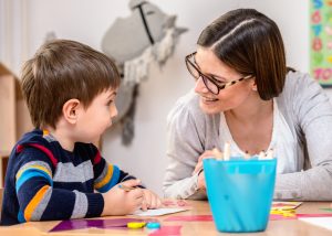 Mother with creative son having fun time together
