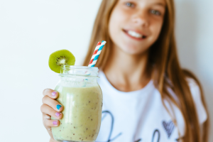 girl holding a smoothie