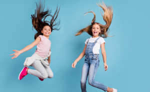 Blue background with girls jumping