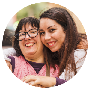 a photo of 2 women looking at the camera and smiling
