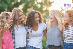Girls standing together laughing