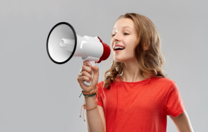 Girl speaking into a megaphone