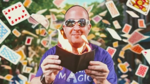 Magician with flying cards behind him