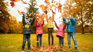 kids playing in leaves